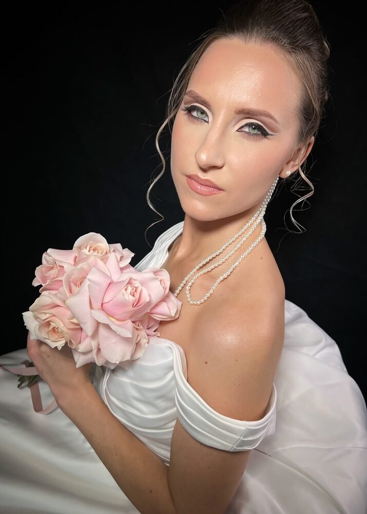 Bridal makeup styled with pearls and pale pink roses