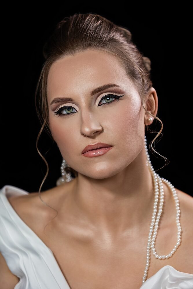 Bridal makeup with an updo and pearl styling