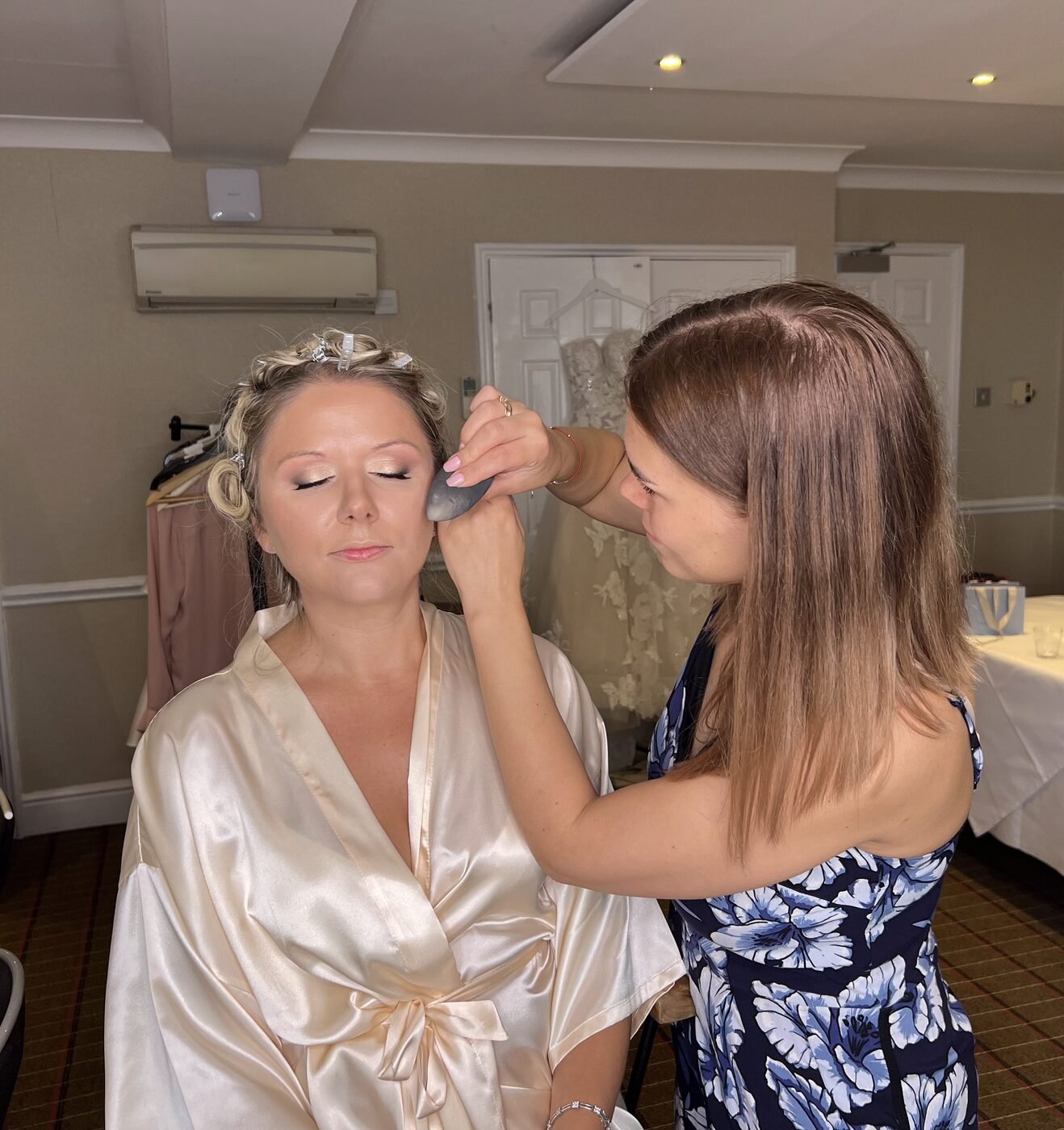 Bridal makeup being applied on the morning of a wedding