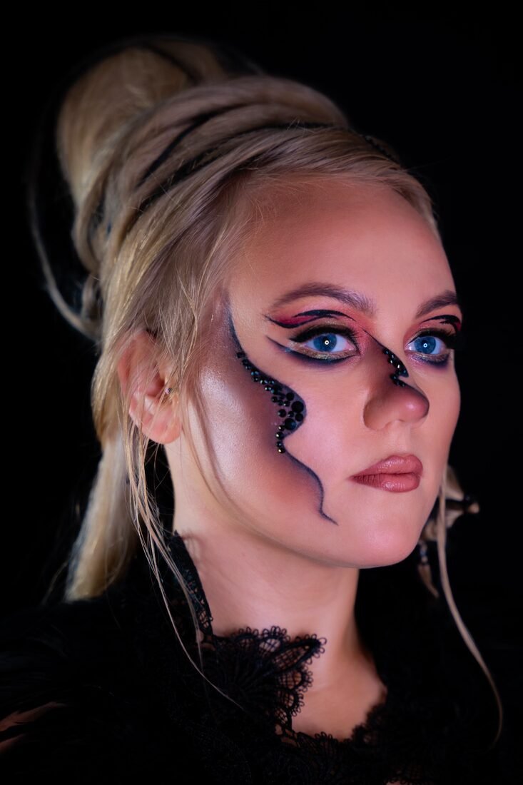 Graphic competition makeup with sculpted colour work across the cheek