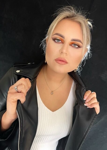 Soft glam makeup with a warm smoky eye and glossy lip
